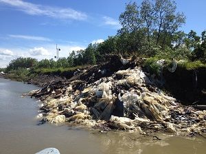 Alakanuk southside dumpsite eroding into river