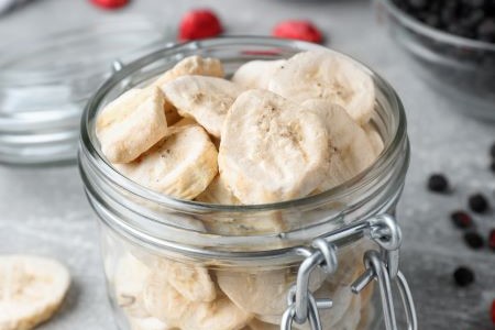 Freeze-dried pieces of banana in a jar