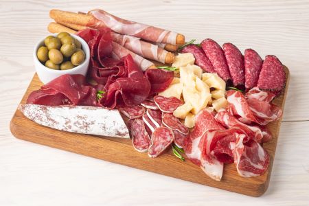 Charcuterie board with assorted cured meats